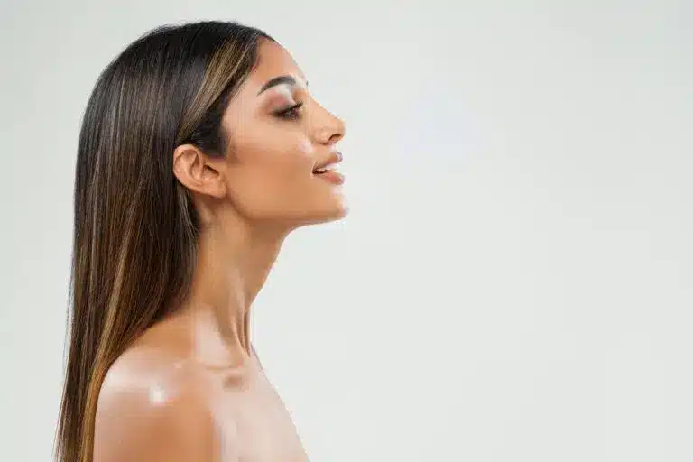 Woman's side profile with harmonious facial features after a nose job in Los Altos, CA